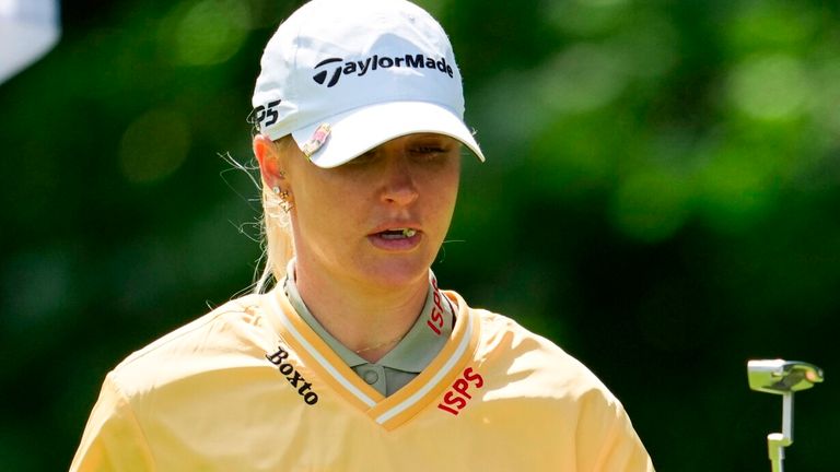 Charley Hull celebrates with her caddie on the sixth green during the first round of the Queen City Championship LPGA