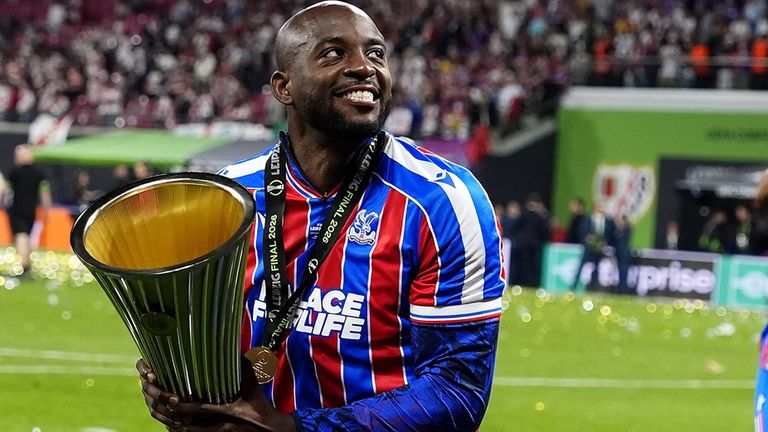 Jean-Philippe Mateta celebrates with the UEFA Conference League trophy after his winning goal against Rayo Vallecano