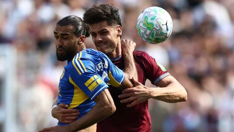 Dominic Calvert-Lewin vies for possession with Konstantinos Mavropanos