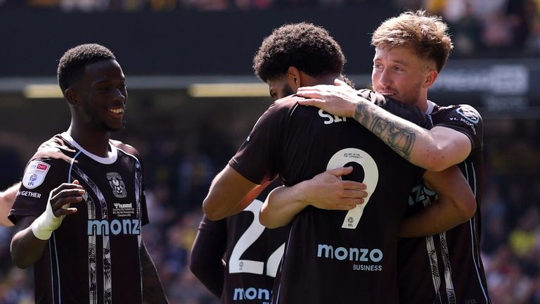 Coventry players congratulate goalscorer Ellis Simms at Vicarage Road