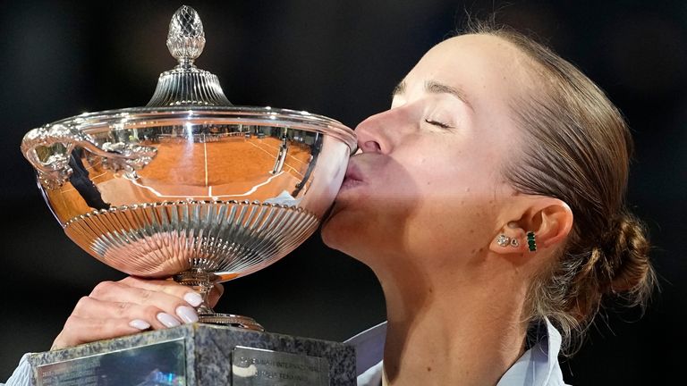 Ukraine's Elina Svitolina kisses the trophy after winning against United States' Coco Gauff at the end of the women's final match at the Italian Open tennis tournament in Rome, Saturday, May 16, 2026. (AP Photo/Alessandra Tarantino)