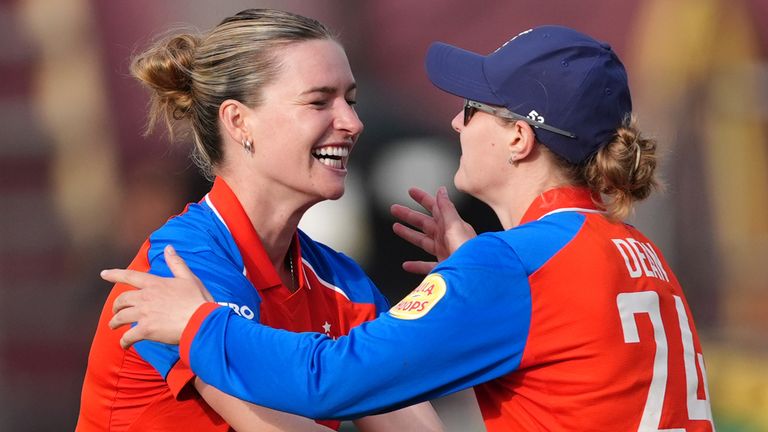 England's Lauren Bell and Charlie Dean celebrate dismissing India's Smriti Mandhana 