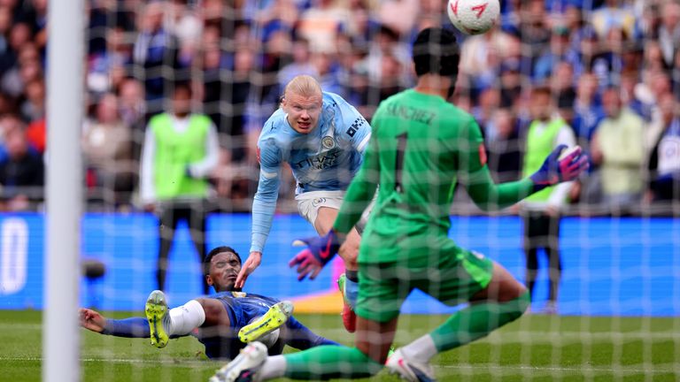 Erling Haaland forces a save from Robert Sanchez