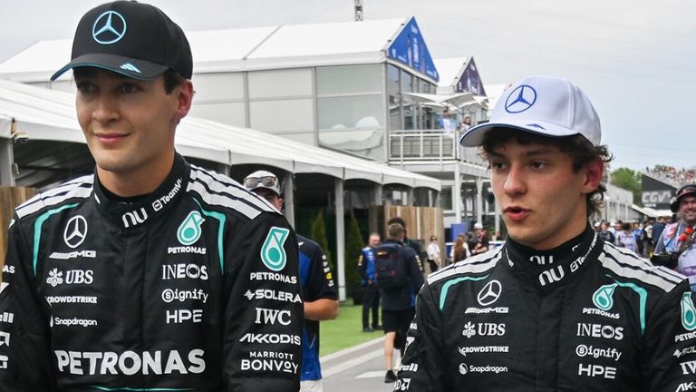 Mercedes driver George Russell, left, of Britain, and teammate Kimi Antonelli, of Italy, talk after placing first and second during qualifying at the F1 Canadian Grand Prix auto race in Montreal, Saturday, May 23, 2026. (Graham Hughes/The Canadian Press via AP)