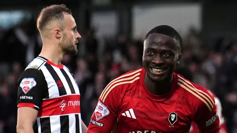 Dan Udoh celebrates scoring for Salford
