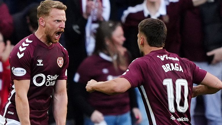 Hearts' Stephen Kingsley (left) celebrates scoring their side's equaliser against Rangers
