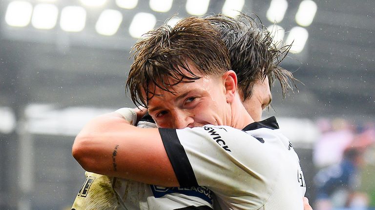 Hull FC's Logan Moy congratulates Tom Briscoe on scoring 