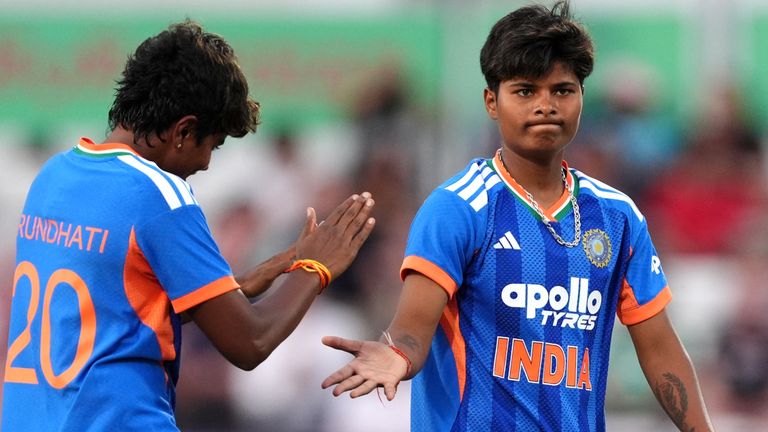 India's Arundhati Reddy and Kranti Gaud celebrate the wicket of England's Sophia Dunkley