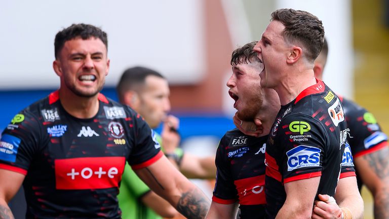 Wigan's Jack Farrimond celebrates scoring a try against St Helens. [SW Pix]