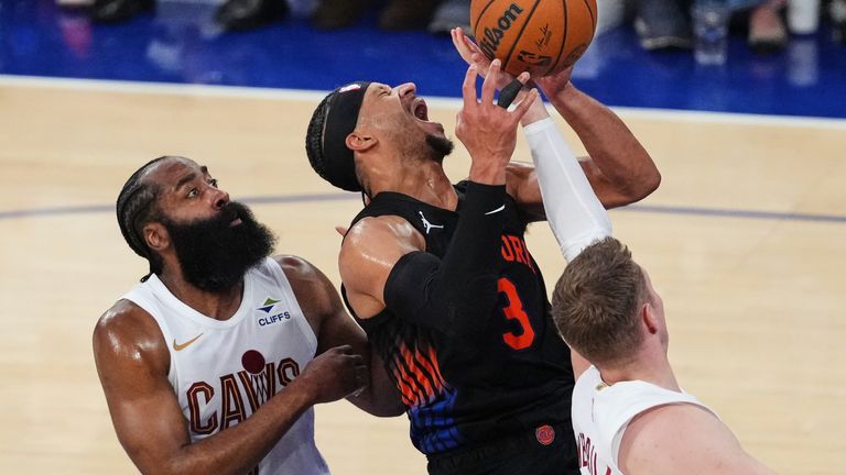 Cleveland Cavaliers' James Harden, left, and Sam Merrill defend New York Knicks' Josh Hart, center, during the second half of Game 2 in the Eastern Conference finals NBA basketball playoffs series, Thursday, May 21, 2026, in New York. (AP Photo/Frank Franklin II)