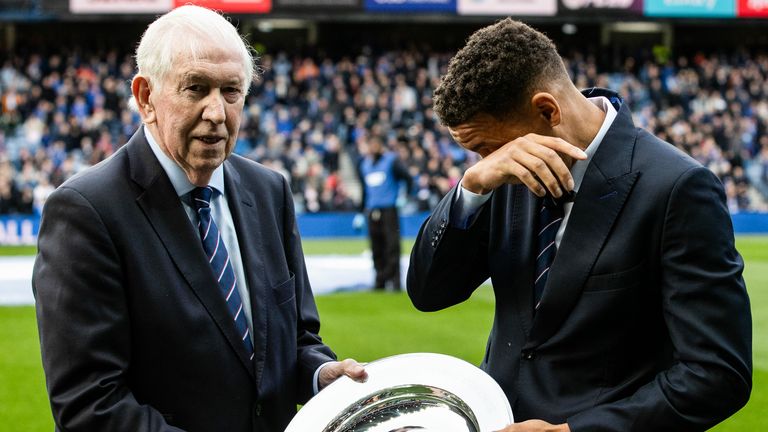 Rangers' James Tavernier (R) is presented a plate by Rangers Legend John Greig (L) to mark his final season 