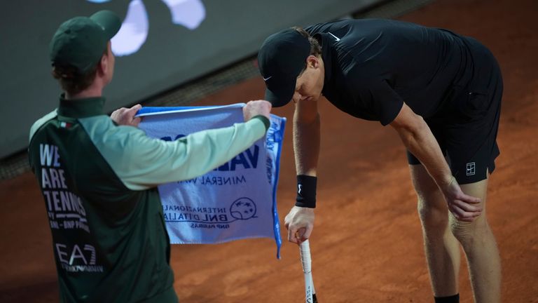 Italy's Jannik Sinner takes a break as he plays against Daniil Medvedev of Russia during their semifinal match at the Italian Open tennis to