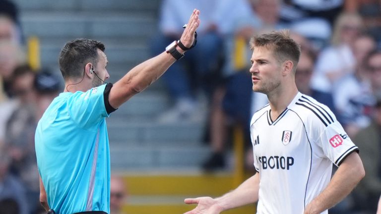 Fulham's Joachim Andersen reacts after being shown a red card by referee Andy Madley