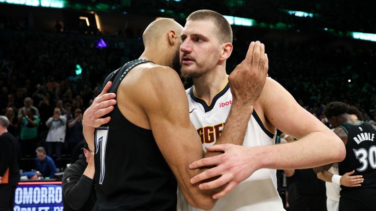 Denver Nuggets center Nikola Jokic, right, and Minnesota Timberwolves center Rudy Gobert hug after Game 6