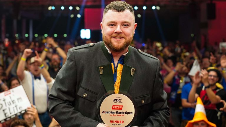 Josh Rock celebrates victory at the Austrian Darts Open in his green jacket (Pic: Paul Targyik/PDC Europe)