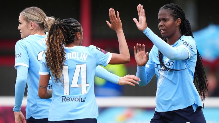 Khadija Shaw celebrates after extending Man City's lead at West Ham