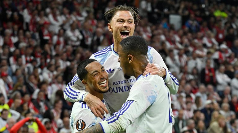 Youri Tielemans, Matty Cash and Ezri Konsa celebrate