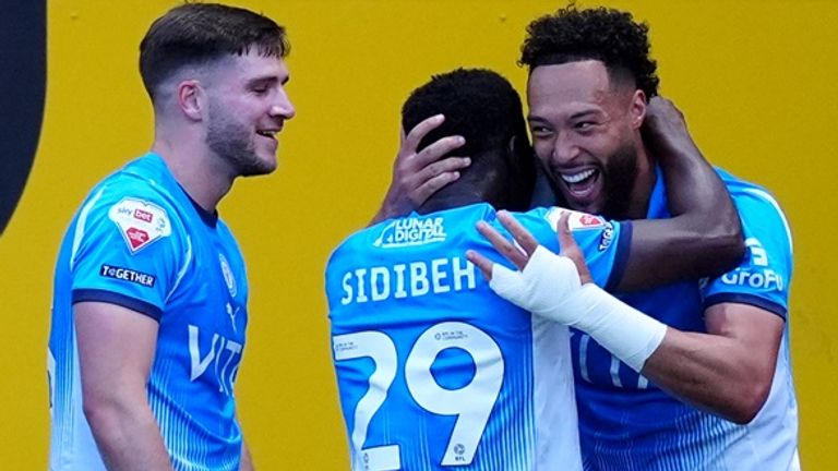 Stockport players celebrate Kyle Wootton (right) helping them take a 2-0 lead on the night over Stevenage