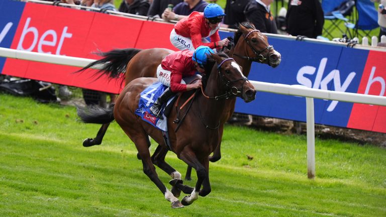 Lilt ridden by Tom Marquand (nearside) coming home to win the Sky Bet Fillies' Stakes