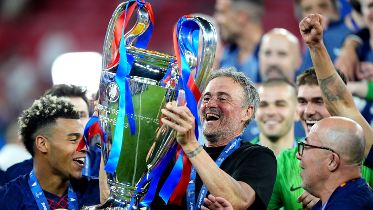 PSG manager Luis Enrique with the Champions League trophy after beating Arsenal