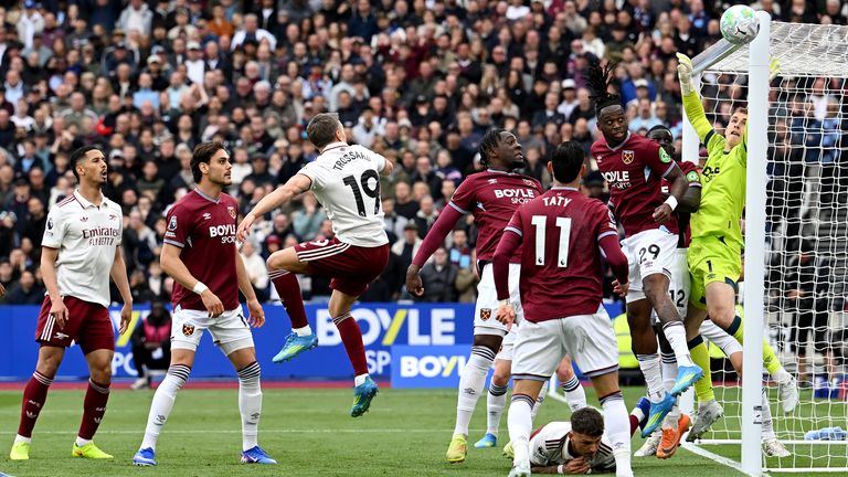 Mads Hermansen of West Ham United saves a header from Leandro Trossard of Arsenal