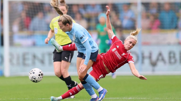 Manchester City's Lauren Hemp collides with Liverpool's Denise O'Sullivan
