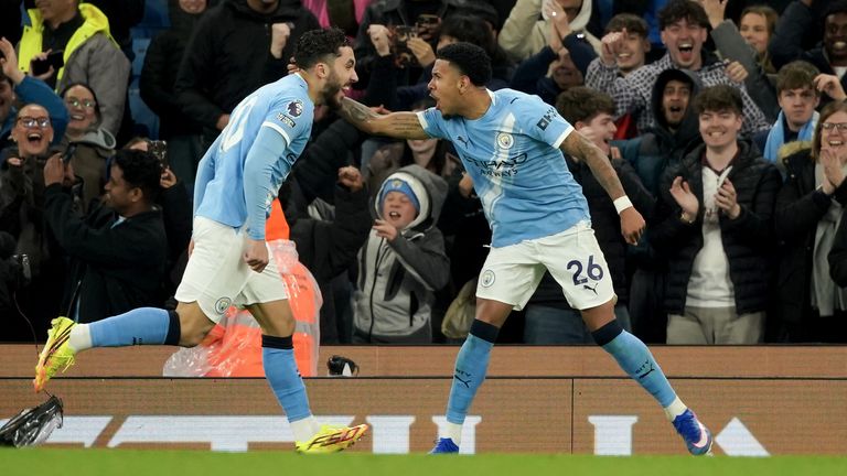Manchester City's Savinho, right, celebrates with Manchester City's Rayan Cherki after scoring his side's third goal during the English Premier League soccer match between Manchester City and Crystal Palace in Manchester, England, Wednesday, May 13, 2026. (AP Photo/Ian Hodgson)