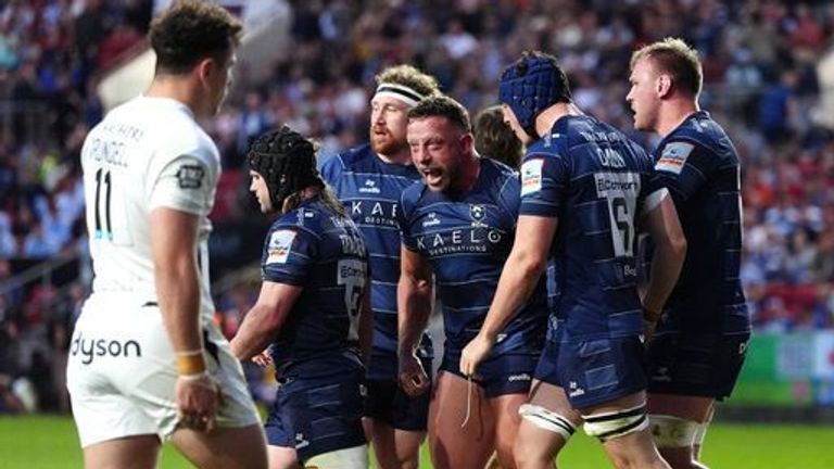 Max Lahiff (centre) and Bristol celebrate after the prop forward scored in their comeback win against Bath 