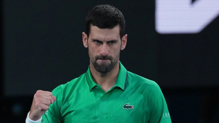 Novak Djokovic of Serbia celebrates winning the first set against Carlos Alcaraz of Spain during the men's singles final at the Australian O