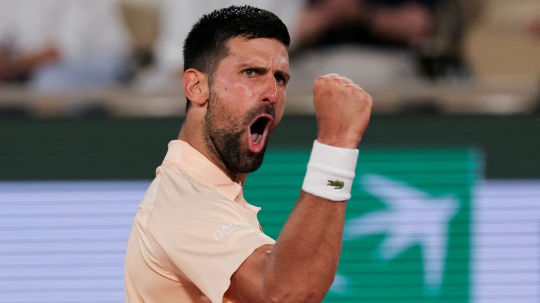 Novak Djokovic celebrates after winning against France's Giovanni Mpetshi Perricard at the end of their men's singles match on day 1 of the 