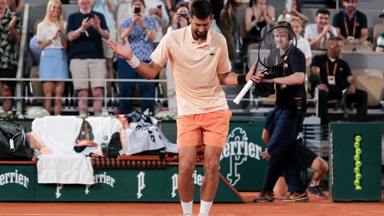 Serbia's Novak Djokovic dances after winning against France's Giovanni Mpetshi Perricard at the end of their men's singles match on day 1 of