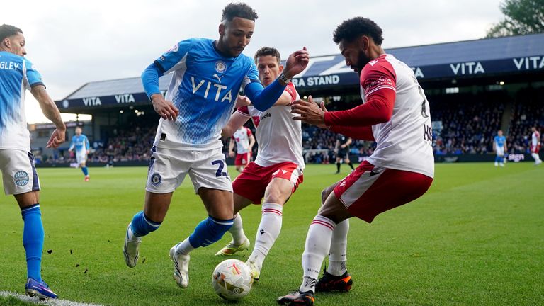 Stockport's Odin Bailey loos to try and beat Stevenage's Jordan Roberts