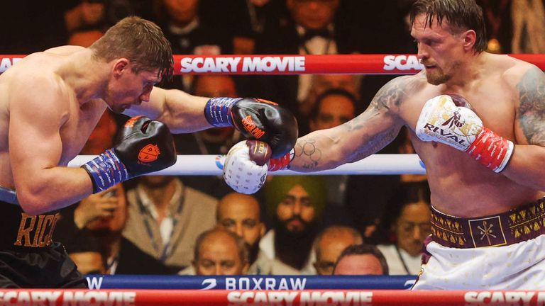 Oleksandr Usyk, right, battles Rico Verhoeven, left, during a boxing match at the WBC World Heavyweight Championship "Glory in Giza" at the site of the Pyramids of Giza, Sunday, May 24, 2026, in Giza, Egypt. (AP Photo)