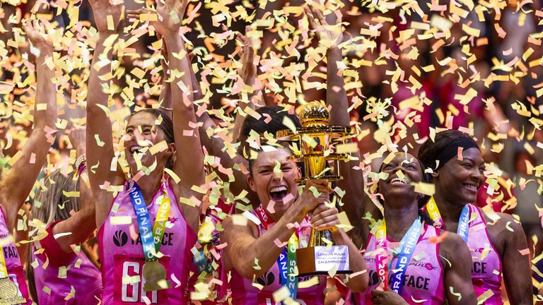 Gracie Smith's London Pulse  celebrate with the trophy after winning the Netball Super League Grand Final