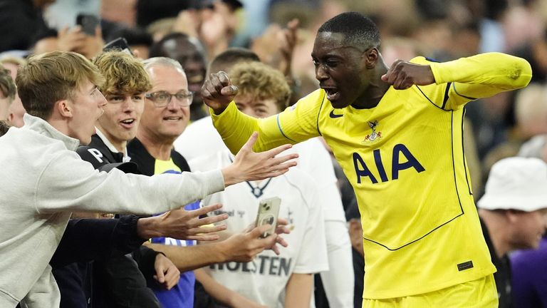 Randal Kolo Muani encourages Spurs supporters after being substituted at Villa Park.