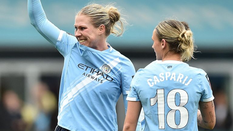 Rebecca Knaak celebrates after scoring a late winner for Man City against Liverpool