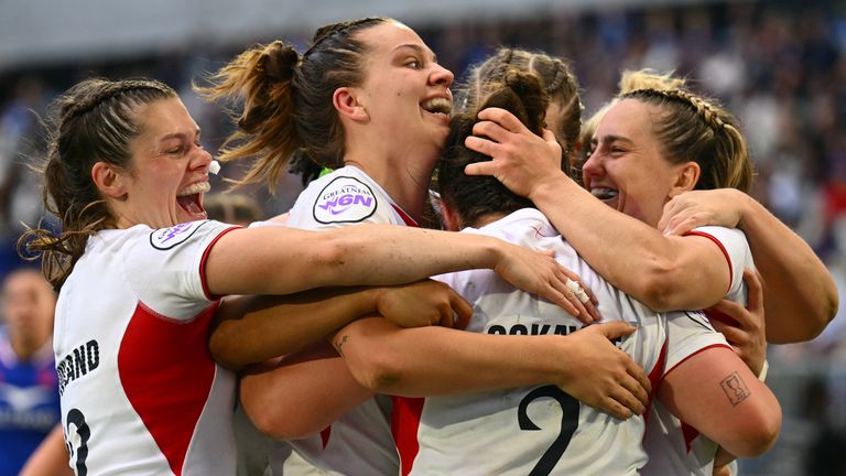 England's Helena Rowland, England's Lilli Ives Campion and England's Claudia Moloney-MacDonald congratulates England's hooker Amy Cokayne (C from behind) after she scored a try during the Women's Six Nations international rugby union match between France and England at the Stade Atlantique in Bordeaux on May 17, 2026. (Photo by GAIZKA IROZ / AFP)