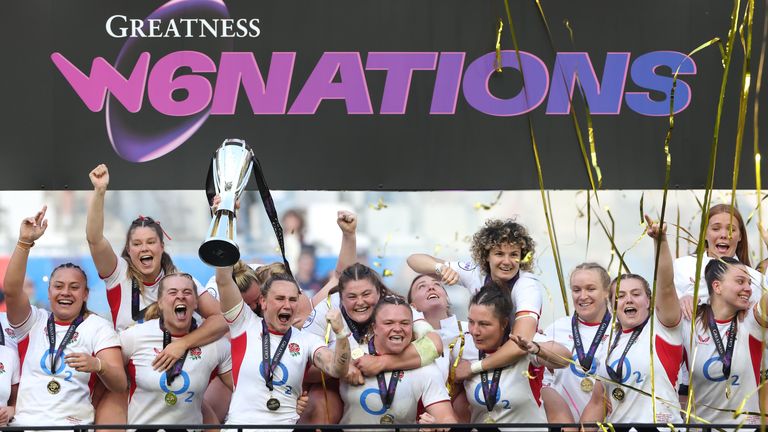 England captain Meg Jones raises the Six Nations trophy aloft