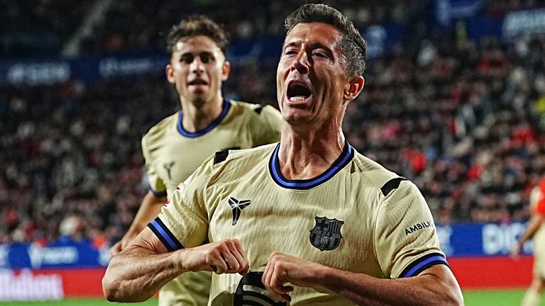 Barcelona's Robert Lewandowski celebrates after scoring his side's opening goal during a Spanish La Liga soccer match between Osasuna and Barcelona in Pamplona, Spain, Saturday, May 2, 2026. (AP Photo/Miguel Oses)