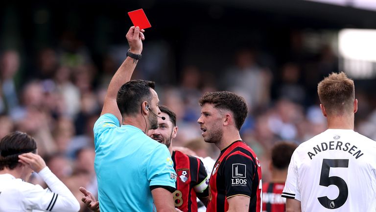 Ryan Christie is shown a red card by referee Andy Madley 