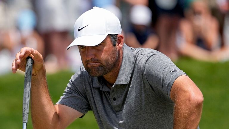 Scottie Scheffler lines up his shot on the seventh green during the final round of the PGA Championship golf tournament at Aronimink