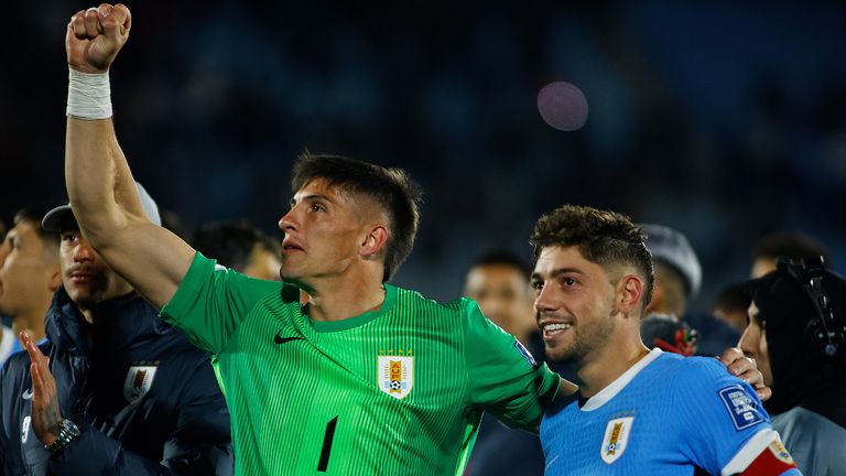 Sergio Rochet (left) and Federico Valverde celebrate in qualifying with Uruguay