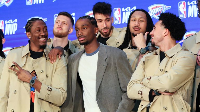 Oklahoma City Thunder guard Shai Gilgeous-Alexander, center, poses with teammates