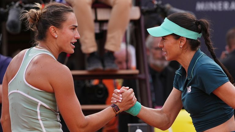 Romania's Sorana Cirstea, right, and Belarus' Aryna Sabalenka react at the end of the match at the Italian Open tennis