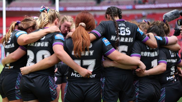  Wembley Stadium, London, England - St Helens' console themselves after defeat against Wigan.