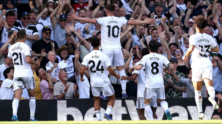 Tom Cairney celebrates after doubling Fulham's lead against Newcastle