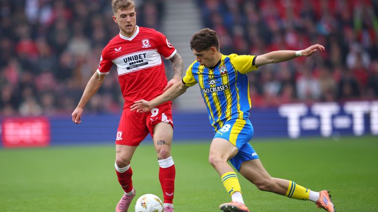 Tom Fellows of Southampton is challenged by Riley McGree of Middlesbrough