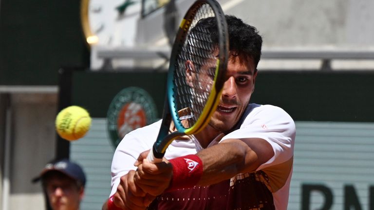 Adolfo Daniel Vallejo of Paraguay returns to Moise Kouame of France during their second round men's singles tennis match at the French Open