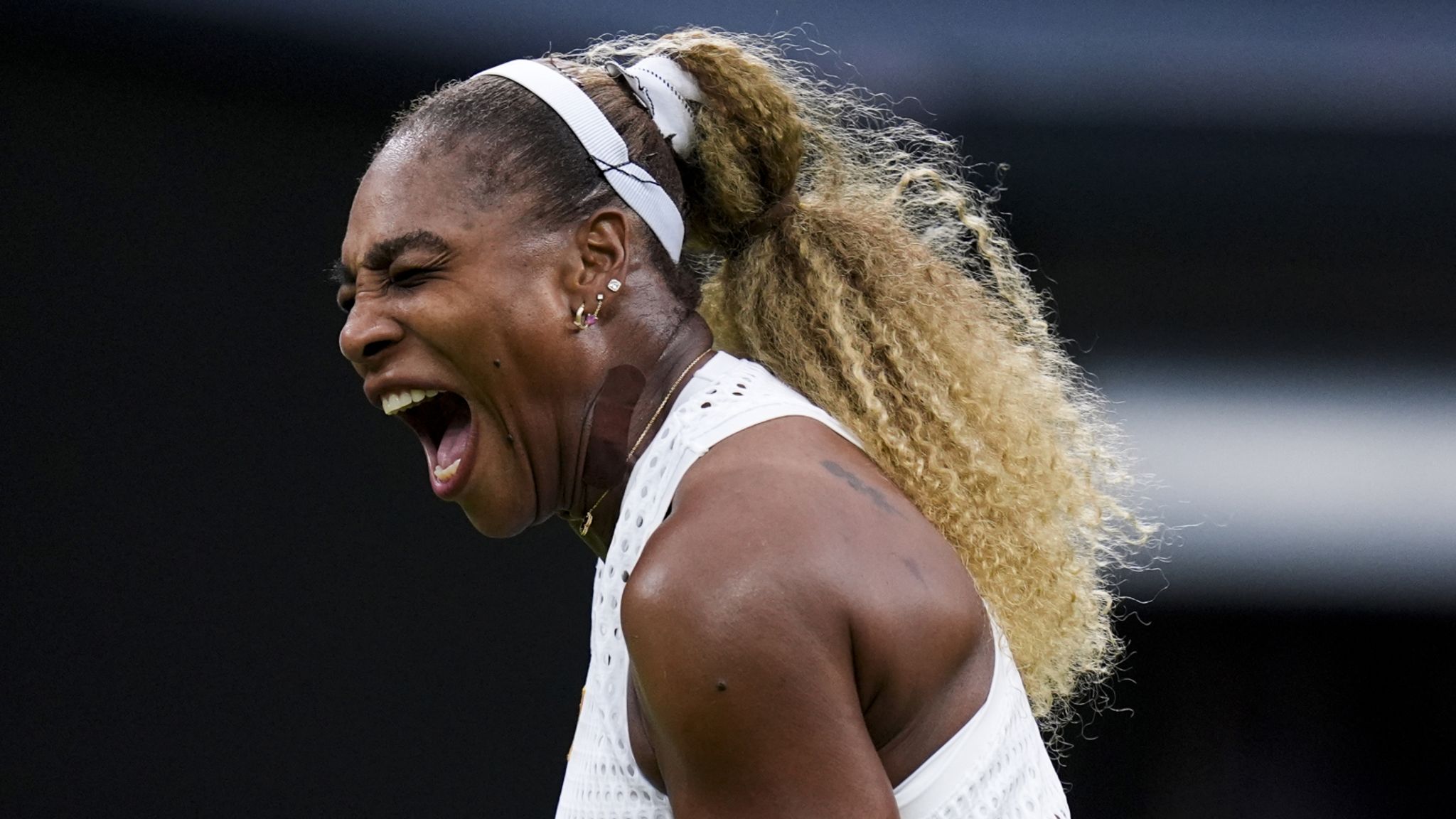 Serena Williams celebrates winning a key point at Wimbledon