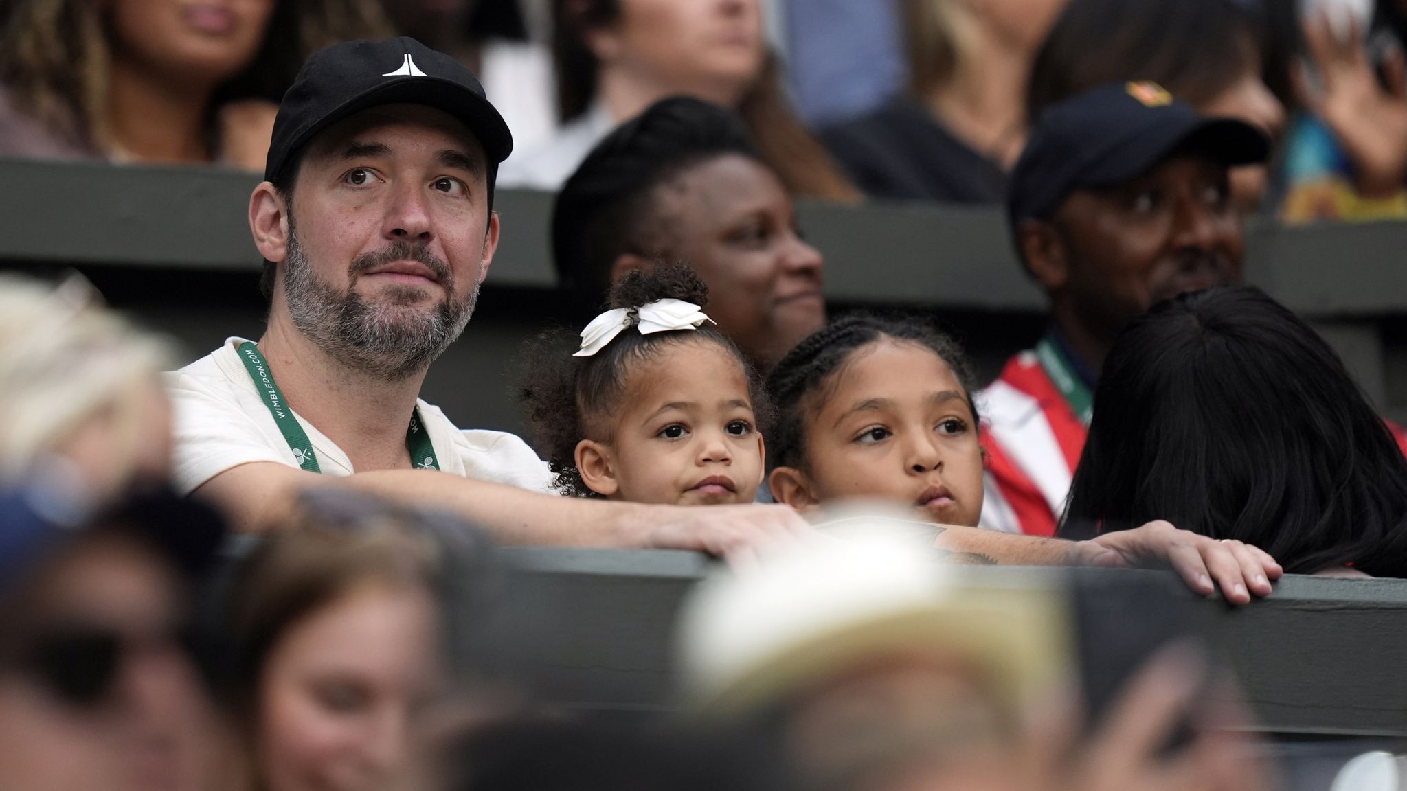 Serena Williams is cheered on by her family in her corner on Centre Court